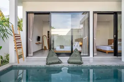 a house with a swimming pool and a bedroom at Peaceful 2BR Pool Villa in Kerobokan - V2 in Kerobokan