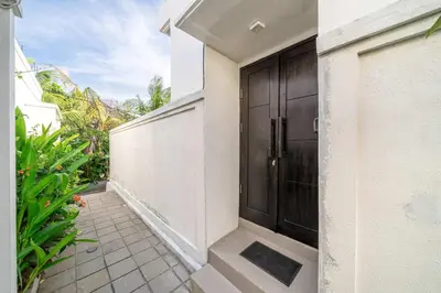 a hallway of a house with a black door at Peaceful 2BR Pool Villa in Kerobokan - V2 in Kerobokan