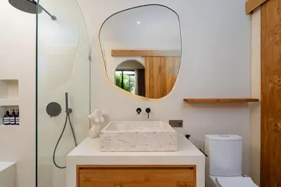 a bathroom with a sink and a mirror at Villa Grace&Glory-2 bedroom villa near Canggu in Kerobokan