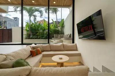 a living room with a couch and a table at Villa Grace&Glory-2 bedroom villa near Canggu in Kerobokan