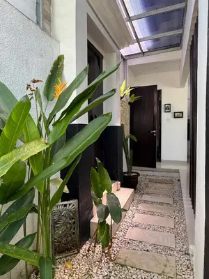 a corridor of a house with a plant at Villa LYM BALI 3br with private pool in Legian