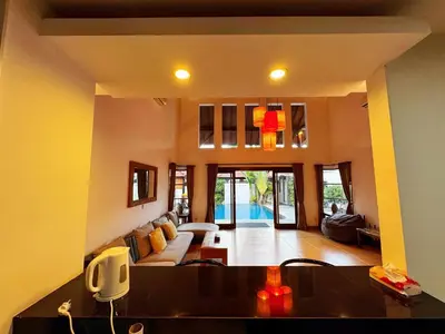 a living room with a couch and a table at Brady's 3 bedrooms Villa Center of Sanur in Sanur