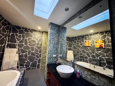 a bathroom with a sink and a tub at Brady's 3 bedrooms Villa Center of Sanur in Sanur