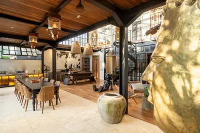 a large living room with a table and chairs at 4 Bedrooms Brand New serenity Villa in Seminyak