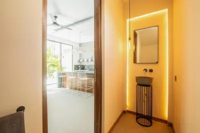 a bathroom with a sink and a mirror at Chic Modern 3BR Villa, Enclosed Living Room in Canggu