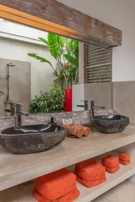 two sinks on a counter in a bathroom at Incredible 3BR Villa In The Heart Of Seminyak in Seminyak