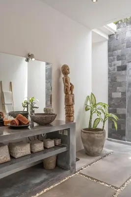 a bathroom with a console table and a mirror at Incredible 3BR Villa In The Heart Of Seminyak in Seminyak