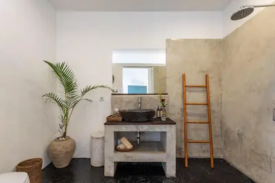 a kitchen with a sink and a wooden ladder at Central Oberoi Seminyak Newly Renovated Villa Riva in Seminyak
