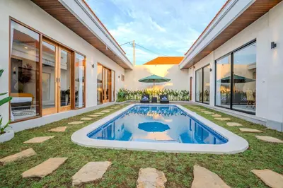 a swimming pool in the backyard of a house at Villa Radha Seminyak in Seminyak