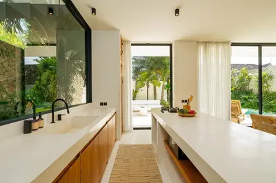 a kitchen with a large sink and a large window at 2 bedroom villa with large garden and near Canggu in Kerobokan