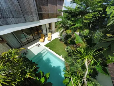 an overhead view of a swimming pool in front of a building at 2 bedroom villa with large garden and near Canggu in Kerobokan