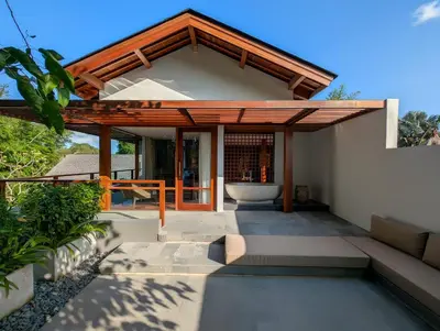 a patio of a house with a pavilion at Jeeva Tirta Seminyak in Canggu