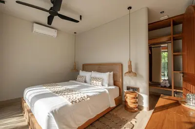 a bedroom with a bed and a ceiling fan at New SASS Villa - Stylish & Modern 3BR at Seminyak in Seminyak