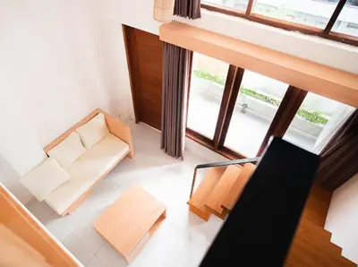 an overhead view of a living room with a couch and chair at Aspen bali nusa dua in Nusa Dua