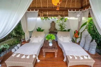 a living room with two couches and a table at Spacious Charming 4BR Balinese Villa, Seminyak in Kerobokan