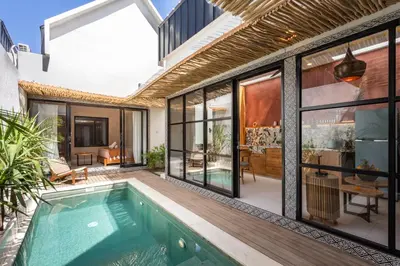 an external view of a house with a swimming pool at Modern and Petite 2bd Seminyak Villa Construction Near in Seminyak