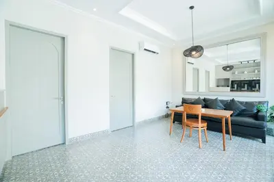 a living room with a table and a couch at Villa Mentari at Umalas in Kerobokan