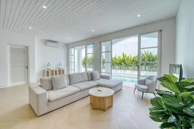 a living room with a couch and a table at Villa Isabella 4BR Brand New in Berawa, Canggu in Canggu