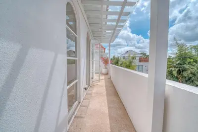 an empty balcony with a view of a building at Villa Isabella 4BR Brand New in Berawa, Canggu in Canggu