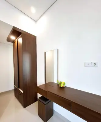 a dressing room with a mirror on the wall at Wisman House by Pigeon in Jimbaran