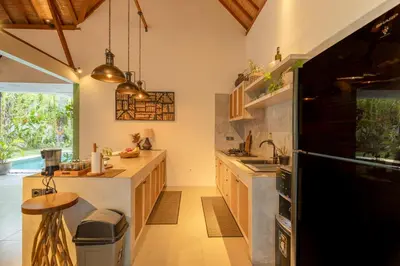 a kitchen with a sink and a counter top at Villa Mint Dua, Peaceful 3BR Villa - Near La favela Seminyak in Seminyak