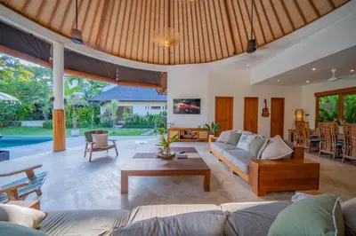 a living room with a couch and a table at 7 BR Luxury Oasis in Seminyak in Seminyak