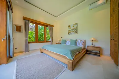 a bedroom with a bed and a window at 7 BR Luxury Oasis in Seminyak in Seminyak