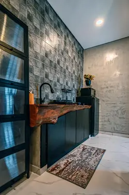 a kitchen with a sink and a counter top at Amshiga 5 in Jimbaran