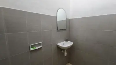 a bathroom with a sink and a mirror at Saphala Suites Secondfloor in Seminyak