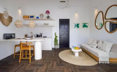 a living room with a couch and a table at Villa Gael by Pertama Management in Seminyak