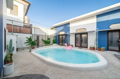 a swimming pool in the backyard of a building at First 5 Loft near Seminyak in Seminyak