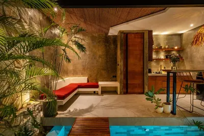 a living room with a couch and some plants at Romantic Honeymoon Villa - Private Pool & Netflix in Dalung