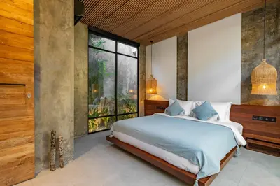 a bedroom with a large bed and a large window at Romantic Honeymoon Villa - Private Pool & Netflix in Dalung