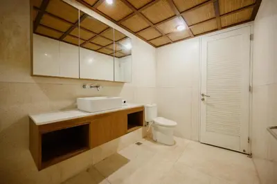 a bathroom with a sink and a toilet at UrbanVilla in Legian