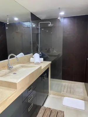 a bathroom with a sink and a shower at Luxury 3 BR Elegant intertior Perfect for group in Kerobokan