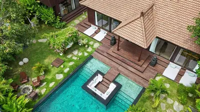an aerial view of a house with a swimming pool at Exclusive 4BR Villa Kito - Cinema, Sauna, Yoga and Pool in Jimbaran