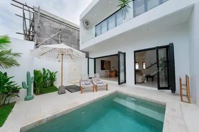 a swimming pool in the backyard of a house at Villa Aura - Spacious 1BR Private Pool Luxury Villa in Seminyak