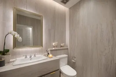 a bathroom with a sink and a toilet and a mirror at Colonial House 4BR Villa Ocean View in Berawa in Canggu