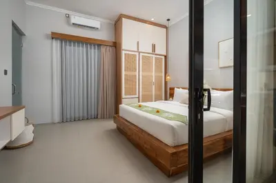 a bedroom with a bed in a room at Villa Bella Poppy in Seminyak