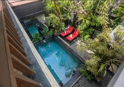 an overhead view of a small pool in a garden at Exquisite 3 BR Villa Seminyak CYN in Seminyak