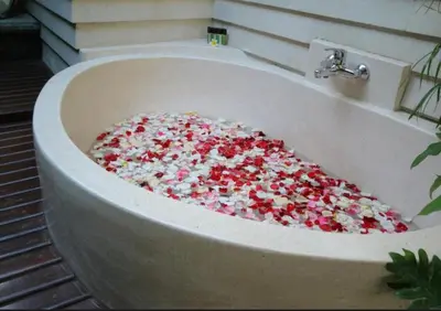 a bath tub filled with sprinkles in a bathroom at Exquisite 3 BR Villa Seminyak CYN in Seminyak