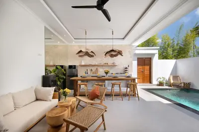 a living room with a couch and a table and a pool at Gorgeous 6 beds, 14 pax in the heart of Seminyak in Seminyak