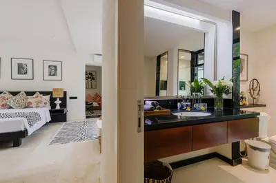 a bathroom with a sink and a mirror at Sophisticated Luxe Martini 1 - 1BR Villa in Kerobokan