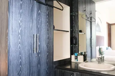 a bathroom with a sink and a mirror at 3BR, 5Beds, 10ppl, Seminyak, BeachSide in Seminyak