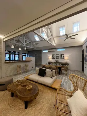 a living room with a couch and a table at Cozy villa 777 near canggu 3BR in Kerobokan