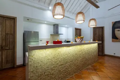 a kitchen with a counter top in a room at Villa Yang Tao 4 in Seminyak