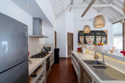 a kitchen with a sink and a counter top at Villa Yang Tao 4 in Seminyak