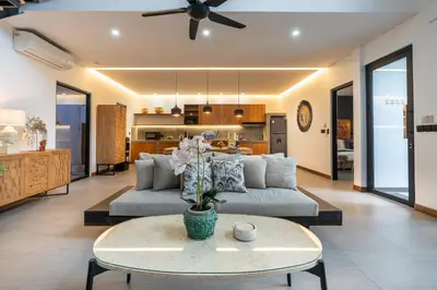 a living room with a couch and a table at Seminyak Villa 2 BR & private pool - Breakfast included in Seminyak
