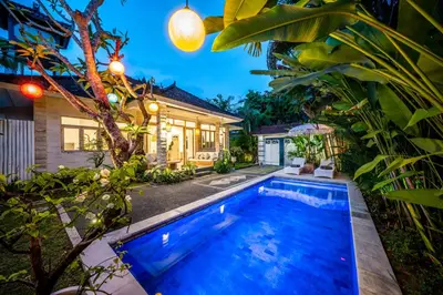 a swimming pool in the backyard of a house at Villa Kensington in Seminyak