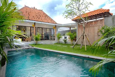 a swimming pool in the backyard of a house at Villa Mertanadi - Cosy 2bdrs in center Kerobokan - popular district in Seminyak